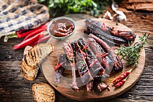 Tasty barbecue grilled pork ribs with chili pepers and parsley h