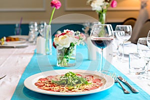 carpaccio on the table in the restaurant photo