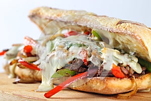 Tasty beef steak sandwich with onions, mushroom and melted provolone cheese