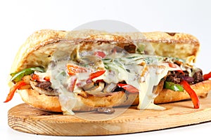 Tasty beef steak sandwich with onions, mushroom and melted provolone cheese