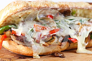 Tasty beef steak sandwich with onions, mushroom and melted provolone cheese