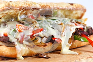 Tasty beef steak sandwich with onions, mushroom and melted provolone cheese