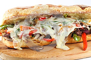 Tasty beef steak sandwich with onions, mushroom and melted provolone cheese