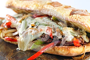 Tasty beef steak sandwich with onions, mushroom and melted provolone cheese