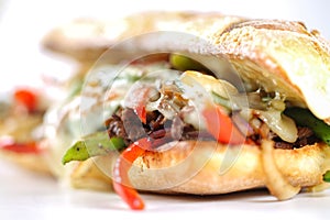 Tasty beef steak sandwich with onions, mushroom and melted provolone cheese