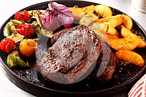 Tasty Beef Steak with Vegetables on Skillet