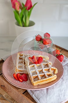 Tasty Belgian Waffles With Berries on a table