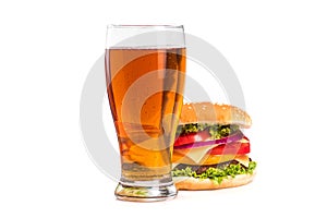 tasty big burger and glass of beer isolated