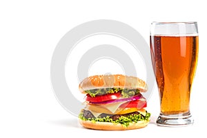 tasty big burger and glass of beer isolated