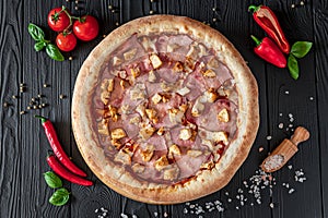 Tasty and big pizza with different types of meat