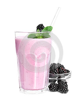 Tasty blackberry milk shake with fresh berries and mint isolated on white