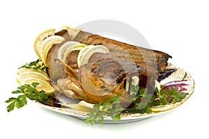 Tasty bloated sheatfish with lemon and parsley photo