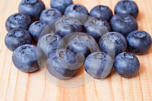 Tasty blueberries on a wooden desk