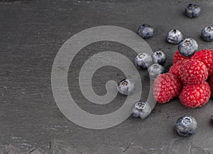 Tasty blueberry and raspberry on white backgroun