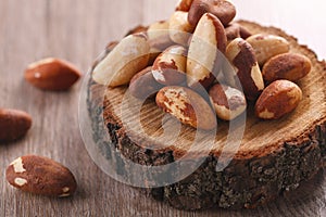 Tasty brasil nuts on wooden background. closeup