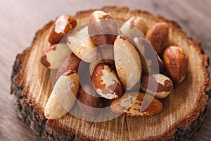 Tasty brasil nuts on wooden background. closeup