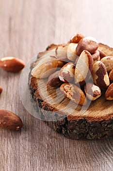 Tasty brasil nuts on wooden background. closeup