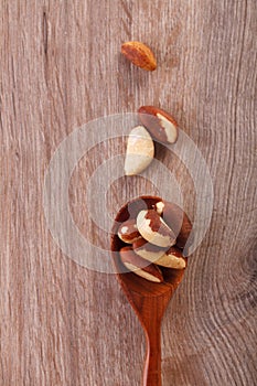 Tasty brasil nuts on wooden background. closeup