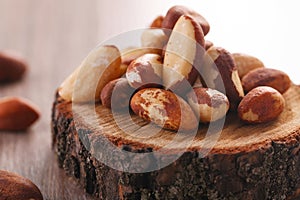 Tasty brasil nuts on wooden background. closeup