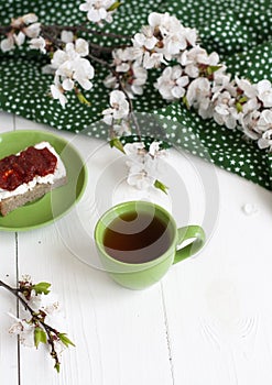 A tasty break: a cup of tea with a rye bread sandwich