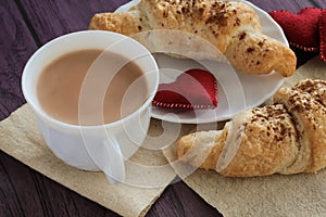 Tasty breakfast cocoa and croissants