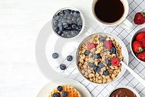 Tasty breakfast served on white table, flat lay