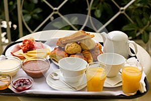 Tasty breakfast for two on the balcony