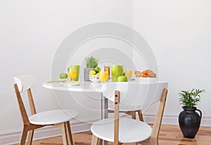Tasty breakfast on a white table photo