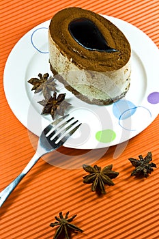 Tasty brown coffee cake with white cream layer.