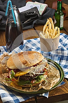 Tasty burger with beef and french fries and soda