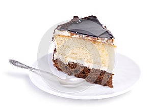 Tasty cake on a white plate over white