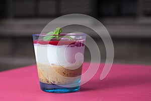 Tasty cheesecake in a glass cup