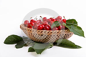 Tasty cherries in a basket isolated on a white