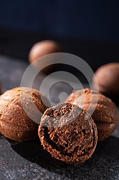 Tasty chocolate balls on a stone dark table