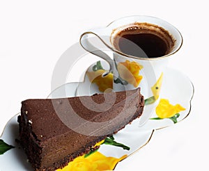 Tasty a chocolate cheese cake with cup of coffee