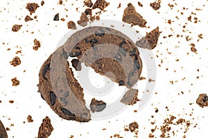 Tasty chocolate chip cookie with chocolate chips and crumbs isolated on white background