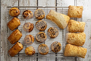 Tasty chocolate cookies, croissant, ciabatta bread