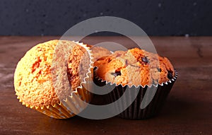 Tasty chocolate cupcakes, muffins on a white wooden table