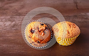 Tasty chocolate cupcakes, muffins on a white wooden table