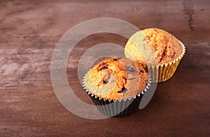 Tasty chocolate cupcakes, muffins on a white wooden table