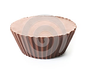 Tasty chocolate peanut butter cup on white background