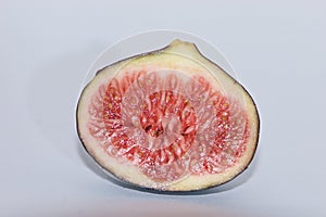 Tasty closeup isolated shiny figs in cross section aus France