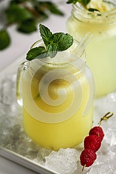 Tasty cold fresh drink lemonade with lemon, ice cream, mint, ice