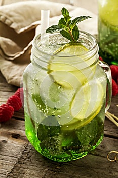 Tasty cold fresh drink lemonade with lemon, mint, ice and lime i