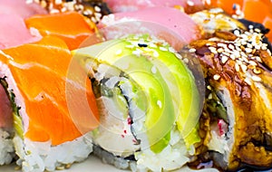 Tasty Colorful assorted Set of different type Sushi. Dinner in Japanese style. Healthy food. Filadelfia and Maki sushi rolls with