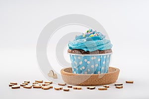 Tasty colorful cupcake isolated on white background.