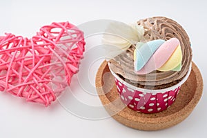 Tasty colorful cupcake isolated on white background.