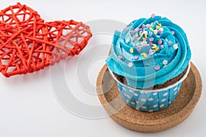 Tasty colorful cupcake isolated on white background.
