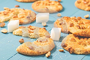 tasty cookies with nuts and lump sugar on a blue wooden background/tasty cookies with nuts and lump sugar on a blue wooden