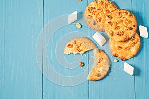 Tasty cookies with nuts and lump sugar on a blue wooden background/tasty cookies with nuts and lump sugar on a blue wooden